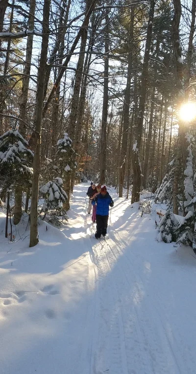Cross country skiers forming winter ADK vacation memories, part of ‘their ADK story.’ Select purchases of ADKaton Life products help fund local groups that work to keep this Adirondack playground healthy and thriving.