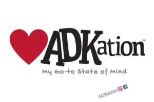 ADKation Life | Oval Adirondack vacation sticker featuring a red heart followed by the fun ‘ADK’ and ‘vacation’ word mash up, ‘ADKation.’ | A loveable ADK sticker for those who have come to discover the Adirondack Mountains as their happy place.