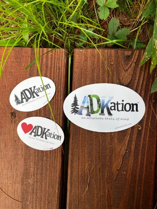 Unique Adirondack vacation souvenir stickers featuring the playful ‘ADK’ plus ‘vacation’ word mash up – ‘ADKation™’.